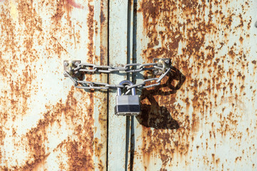 Old gate and rust lock at grunge
