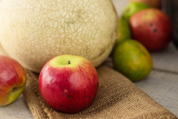 apples with black spots on sack.