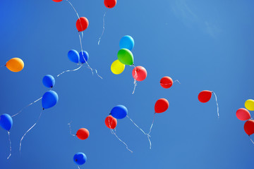Balloons on blue sky background