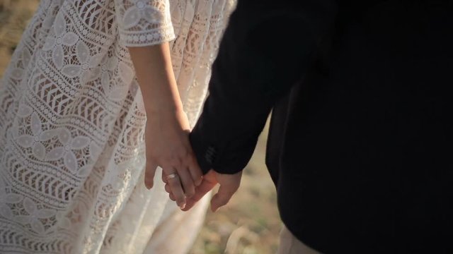 beautiful young couple on the background meadows