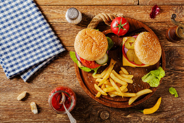 Homemade, beef hamburger with cheese and vegetables.