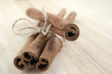 Fresh raw cinnamon sticks tied with natural twine