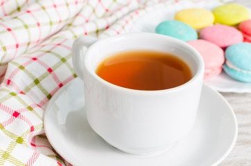 Cup of tea and a cake and macaroon