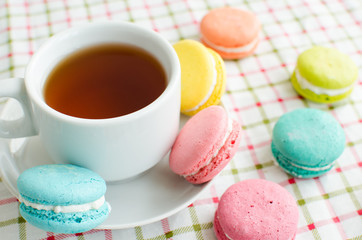 Cup of tea and a cake and macaroon