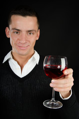 Attractive young man and red wine. 