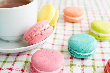 Cup of tea and a cake and macaroon
