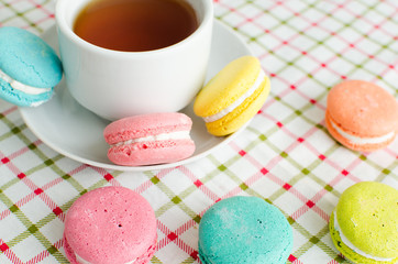 Cup of tea and a cake and macaroon