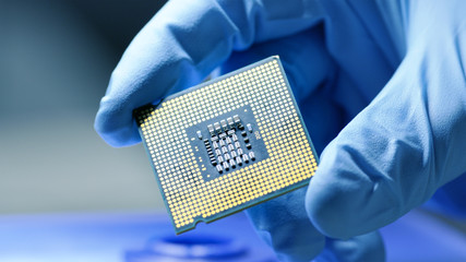 Close-up Presentation of a New Generation Microchip. Gloved Hand Holding Piece of Technological...