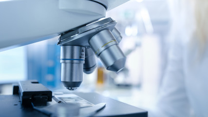 Close-up shot of Scientific Microscope in a Bright Modern Laboratory.