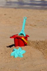 Fototapeta na wymiar Baby beach toys on the sand on a tropical beach
