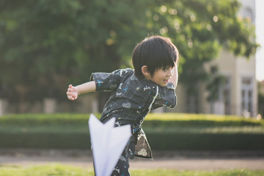 Cute Asian child playing in the park