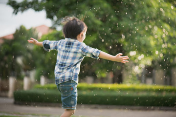 Cute Asian child playing pilot aviator in the park © lalalululala
