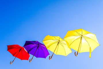 Fototapeta na wymiar flying umbrellas