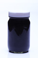 Red Liquid in Glass Bottle white cap