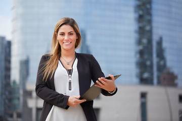 portrait of a professional business woman smiling outdoor