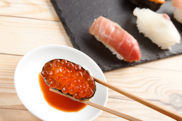 Salmon eggs sushi closeup - 166980698