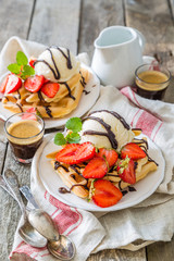 Waffles with strawberry, ice cream and chocolate