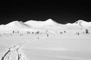 Snow covered high contrast mountainside, Norway