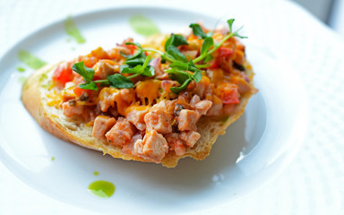 Bruschetta with chicken fillet and herbs