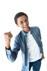 portrait of cheerful african american teenager with fist up isolated on white