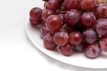 Grapes on a white plate