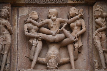 Fototapeta na wymiar Sculpture at Kandariya Mahadeva Temple (the Great God of the Cave) at Khajuraho in Madhya Pradesh, India