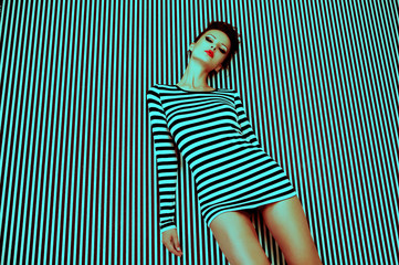 fashion woman in striped dress on  background