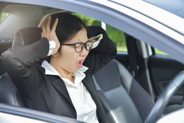 Asian business woman having headache.