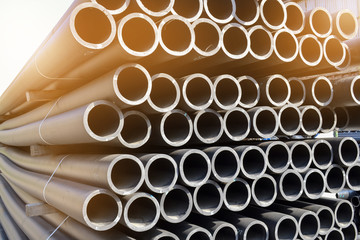 Plastic pipes in stock of finished products stacked in packs