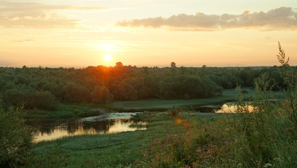 Fototapeta na wymiar Sunrise, forest, meadow and river