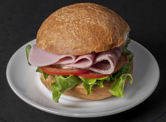 Ham sandwich with tomato and lettuce
