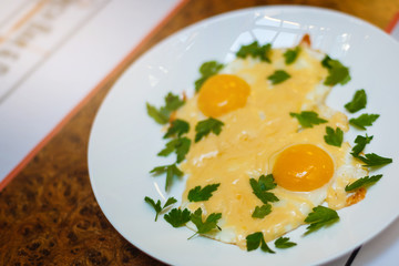 Two fried eggs for healthy breakfast .