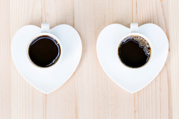Two white coffee cup on wooden table