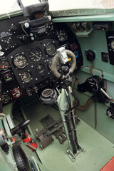 morecambe, england, 02/05/2016, The cockpit and controls inside a world war two spitfire british war plane. Thruster, fuel dials and direction control.