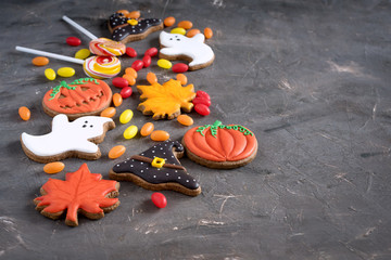 Beautiful and delicious ginger biscuits for Halloween on the background.  Halloween gingerbread background Horizontal photo Halloween sweets Copy space 