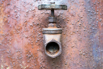 faucet a rusty barrel