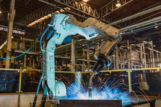 Industrial robot is welding automotive part