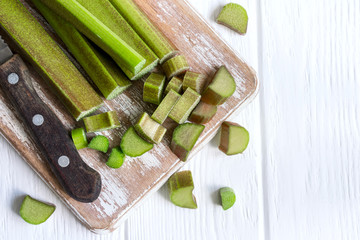 Fresh rhubarb stems on a cutting board