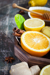 tray with ingredients for making immunity boosting  healthy vitamin drink On dark background