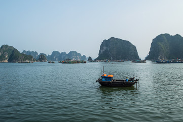 Limestone Formations and Boats in the Ocean at Ha Long Bay, Vietnam