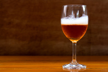 Wine in the glass on the table.