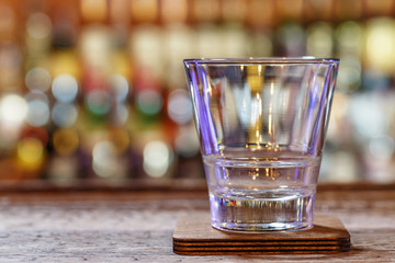 Empty glass on the background of the bar