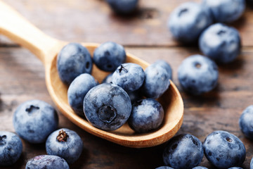 Blueberry in a wooden spoon