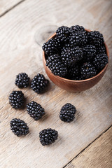 Blackberry on a wooden background