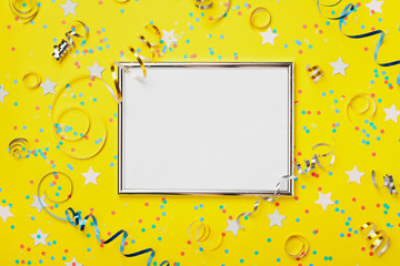 Party, carnival or birthday background decorated silver frame with colorful confetti and streamer...