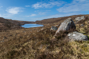 Rocks, heather and loch.