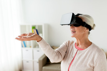old woman in virtual reality headset or 3d glasses