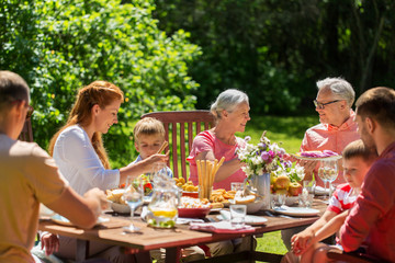 happy family having dinner or summer garden party