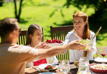 happy family having dinner or summer garden party
