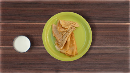 Pancakes in a plate on a table